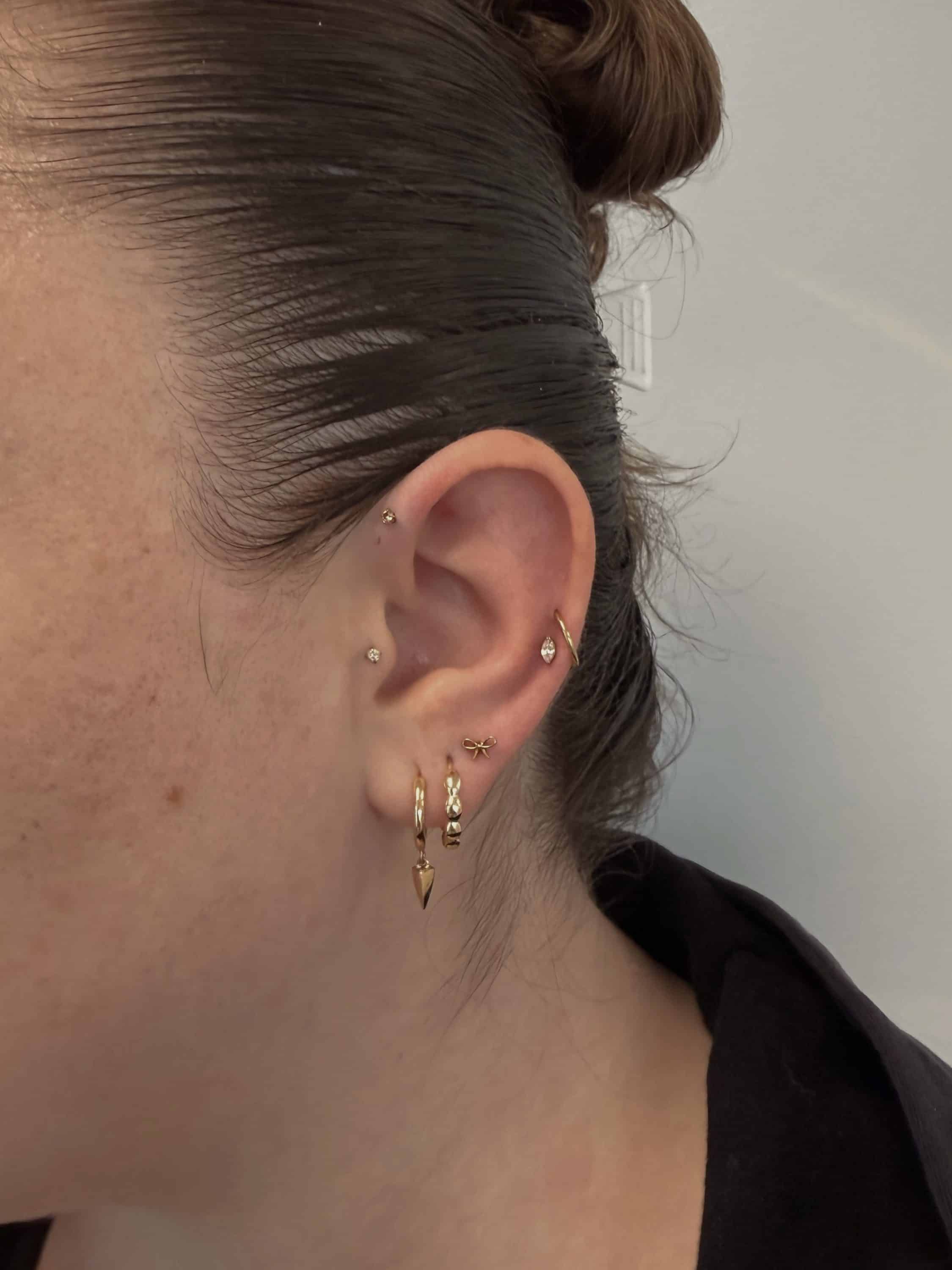 Curated ear stack pierced at the Aurilus studio on Main Street in American Fork, Utah